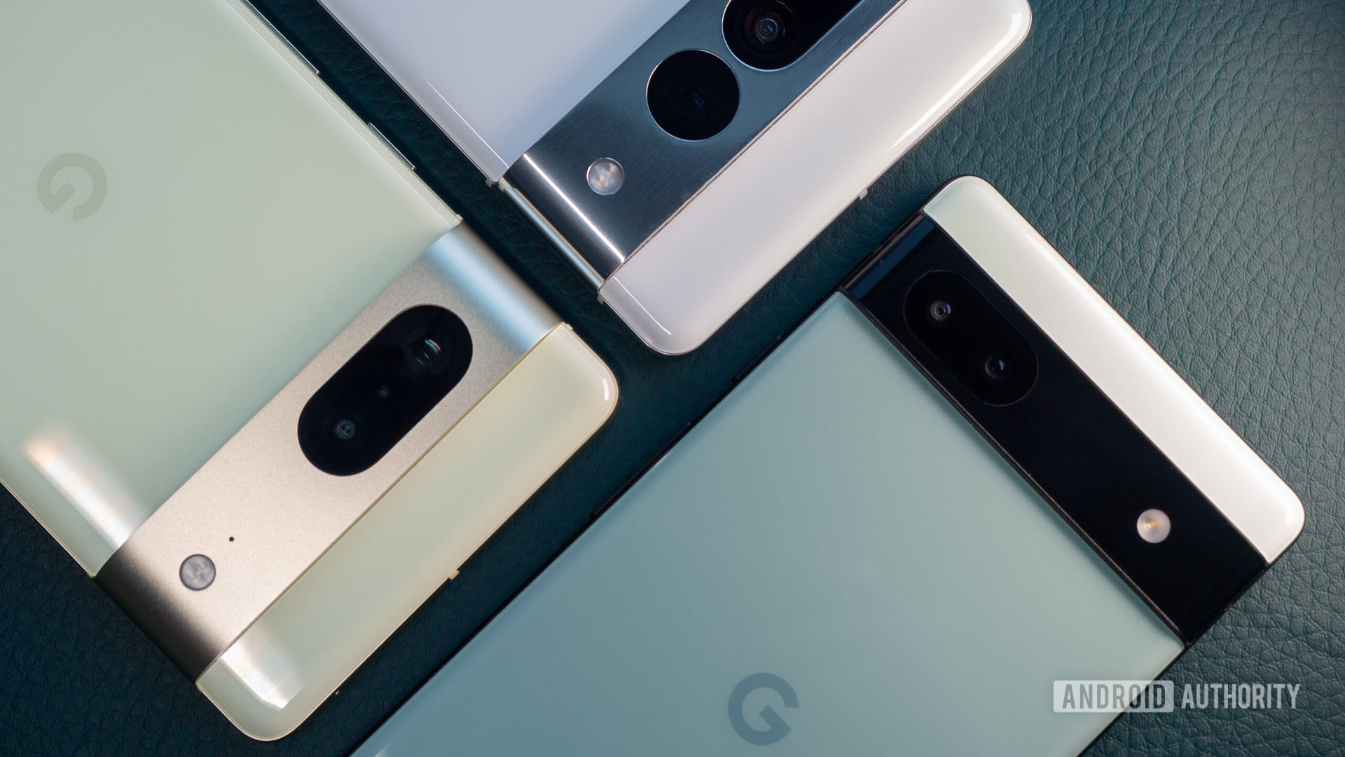 Green Google Pixel 6a next to white Pixel 7 Pro and lime Pixel 7 pixel 6a vs 7 vs 7 pro 3