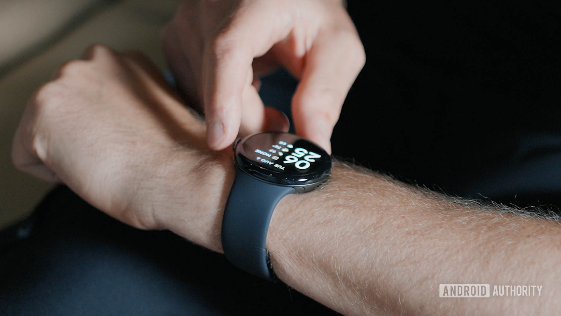 Google Pixel Watch 3 Crown A man pressed the digital crown of his Google Pixel Watch 3.